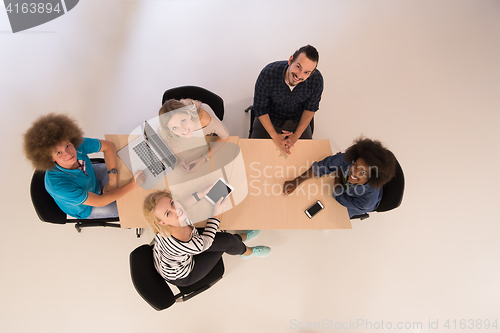 Image of Multiethnic startup business team on meeting  top view