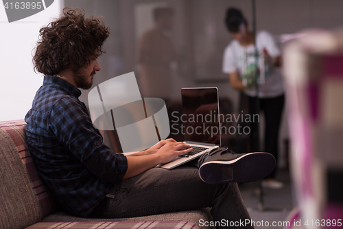 Image of man working with laptop