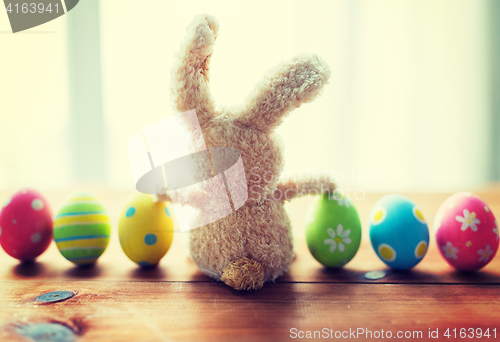 Image of close up of colored easter eggs and bunny