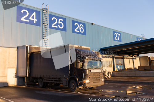 Image of warehouse gates and truck loading