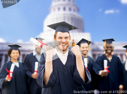 Image of happy student with diploma celebrating graduation