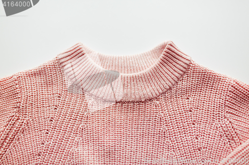 Image of close up of sweater or pullover on white