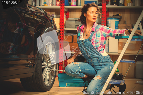Image of beautiful woman car mechanic