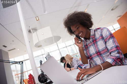 Image of African American informal business woman working in the office