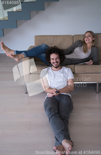 Image of young couple relaxes in the living room