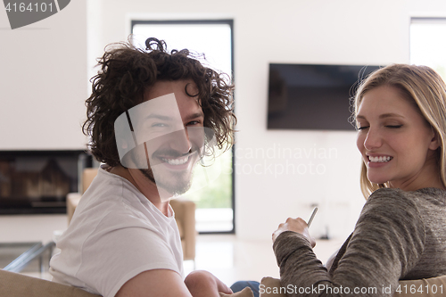 Image of Rear view of couple watching television