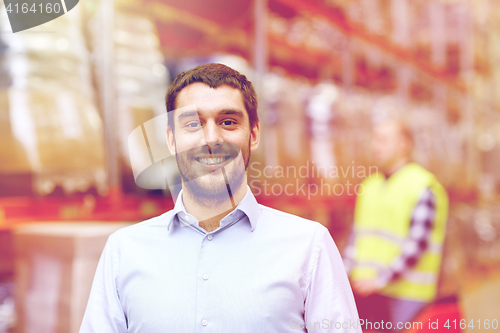 Image of businessman over warehouse loader on forklift 