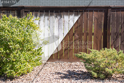 Image of Fence Before and After Solid Paint Stain Application