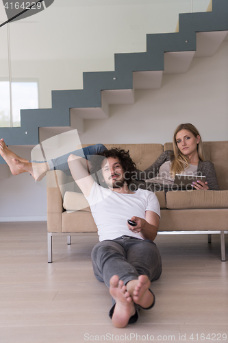 Image of young couple relaxes in the living room