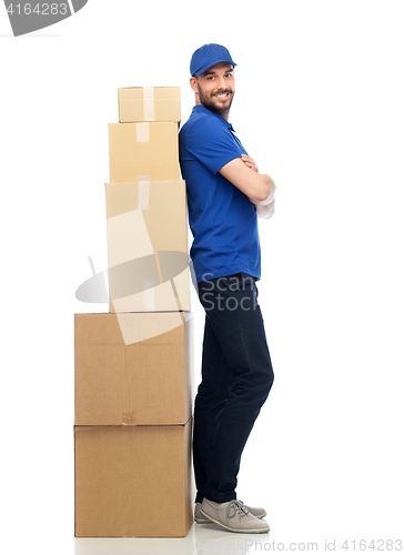 Image of happy delivery man with parcel boxes