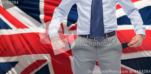 Image of close up of english businessman with empty pockets