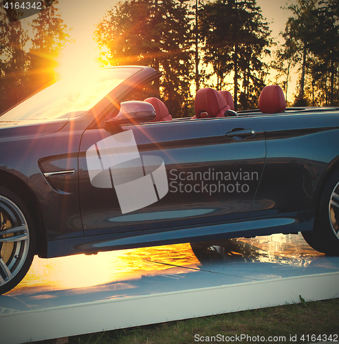 Image of cabriolet car and the sun