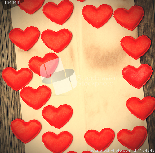 Image of blank old paper with red hearts