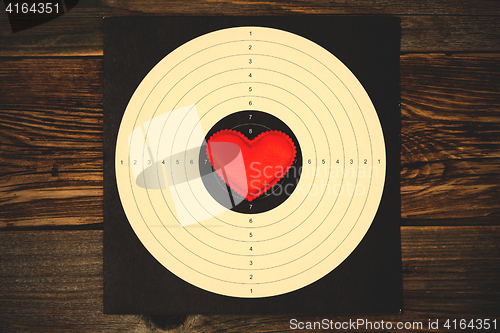 Image of red heart on shooting target