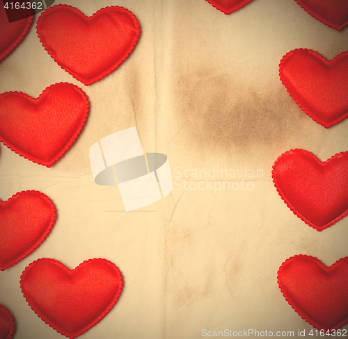 Image of old paper background with red hearts