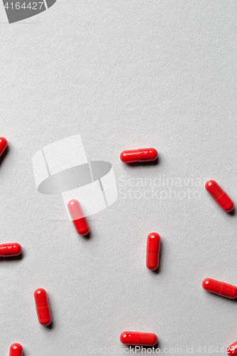 Image of red medicine capsules