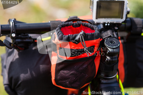 Image of Bicycle with orange bags for travel