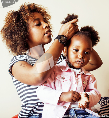 Image of adorable sweet young afro-american mother with cute little daugh