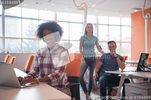 Image of African American informal business woman working in the office