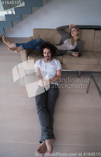 Image of young couple relaxes in the living room