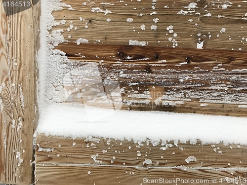 Image of old wood covered with snow background