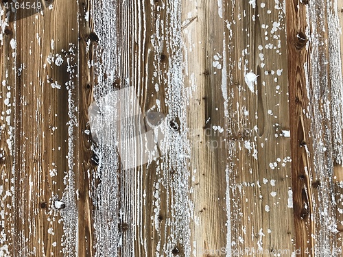 Image of old wood covered with snow background