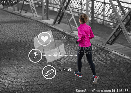 Image of Woman running across the bridge