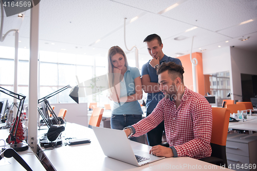 Image of Group of young people employee workers with computer