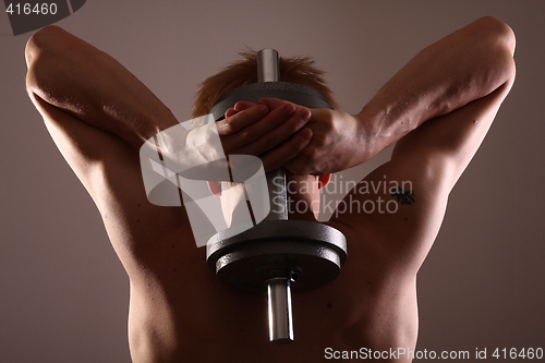 Image of Man training with weight