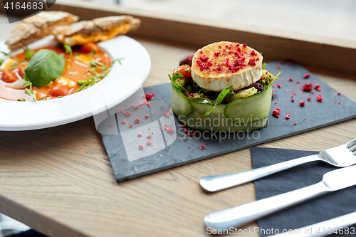 Image of goat cheese salad and gazpacho soup at restaurant