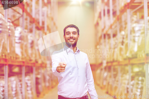 Image of happy man at warehouse