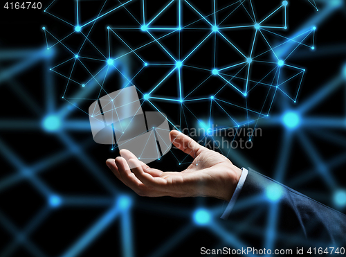 Image of close up of businessman hand with hologram