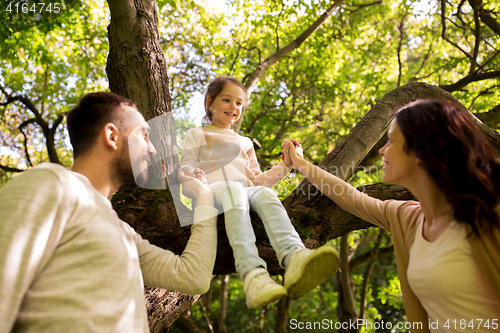 Image of happy family in summer park having fun