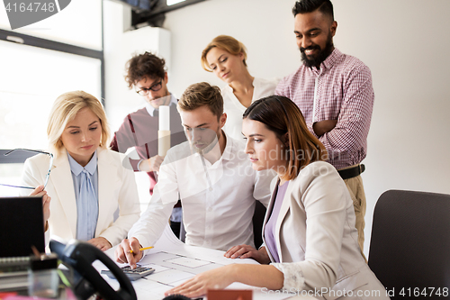 Image of business team discussing house project at office