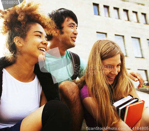 Image of cute group teenages at the building of university