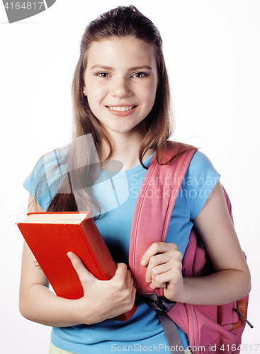 Image of young cute teenage girl posing cheerful against white background with books and backpack isolated