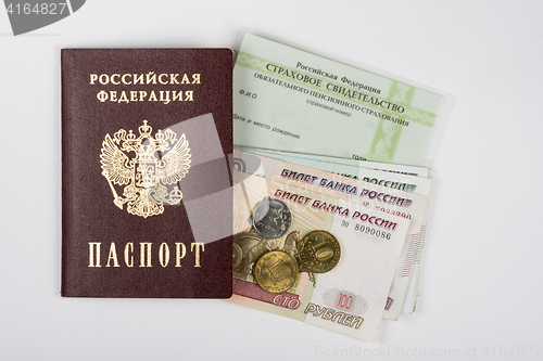 Image of Passport, insurance certificate and money on a white background