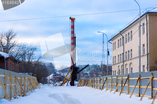 Image of Construction of bridge in winter in city
