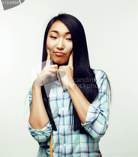 Image of young pretty asian woman posing cheerful emotional isolated on white background, lifestyle people concept 