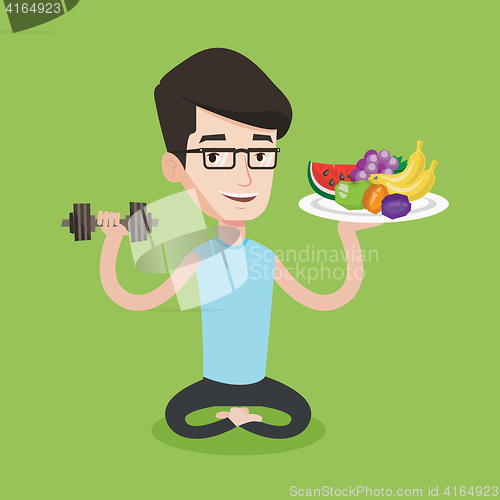 Image of Healthy man with fruits and dumbbell.