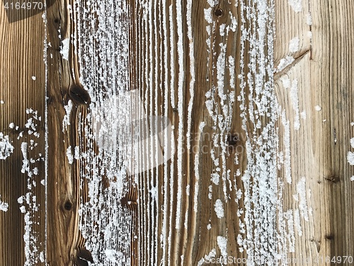 Image of old wood covered with snow background