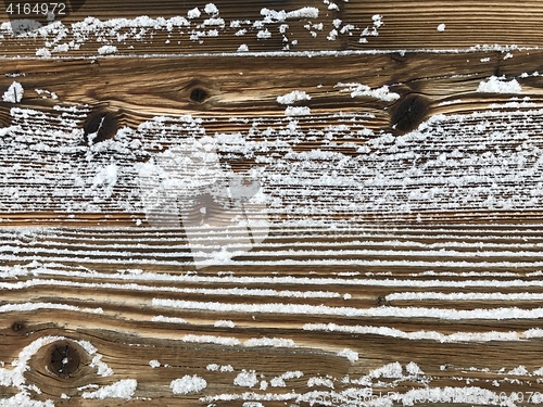 Image of old wood covered with snow background