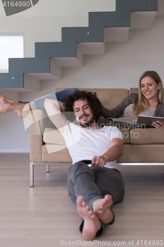 Image of young couple relaxes in the living room
