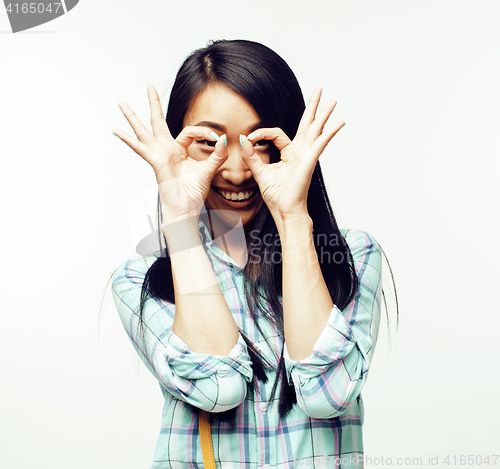 Image of young pretty asian woman posing cheerful emotional isolated on white background, lifestyle people concept 
