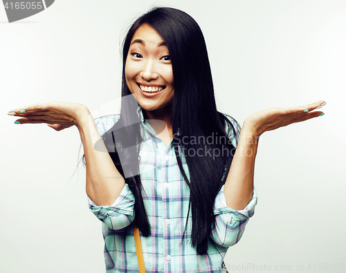 Image of young pretty asian woman posing cheerful emotional isolated on white background, lifestyle people concept 