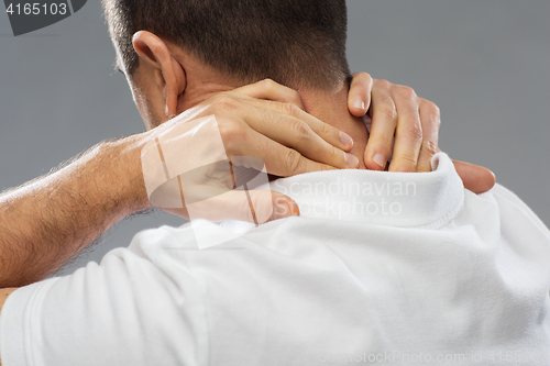 Image of close up of man suffering from neck pain