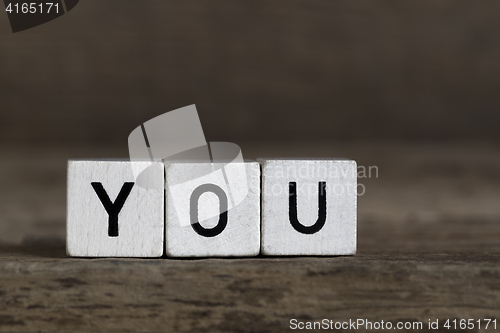 Image of You, written in cubes on wooden background