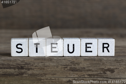 Image of German word tax, written in cubes 