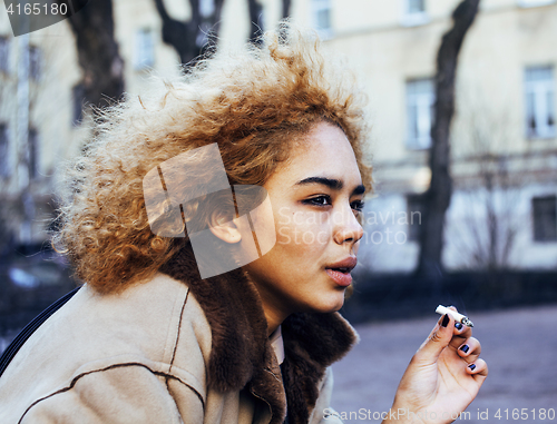 Image of young pretty girl teenage outside smoking cigarette close up, lo