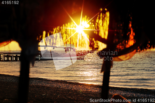 Image of sun on beach at sunday